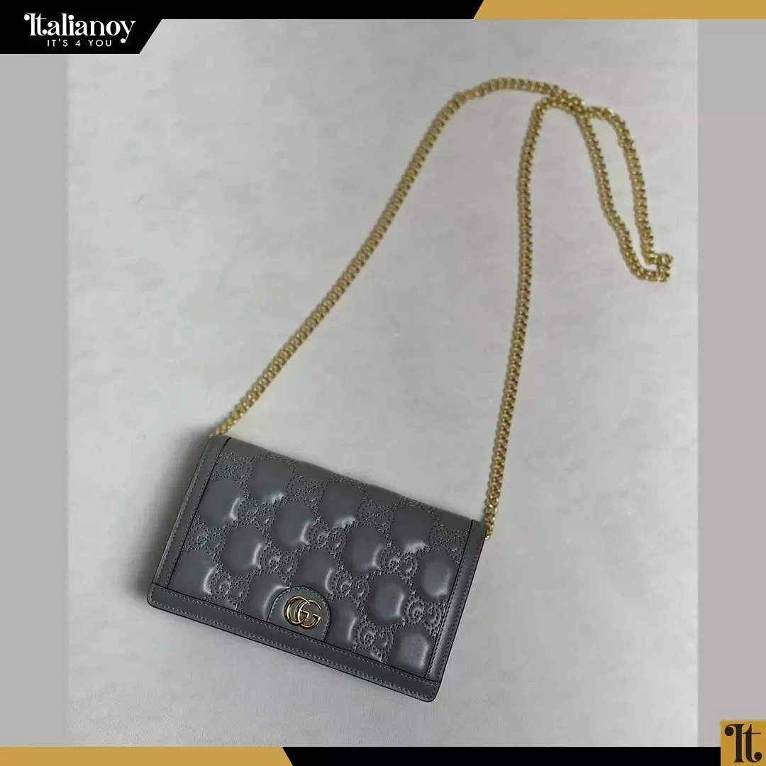 A square padded bag with flap details and chain